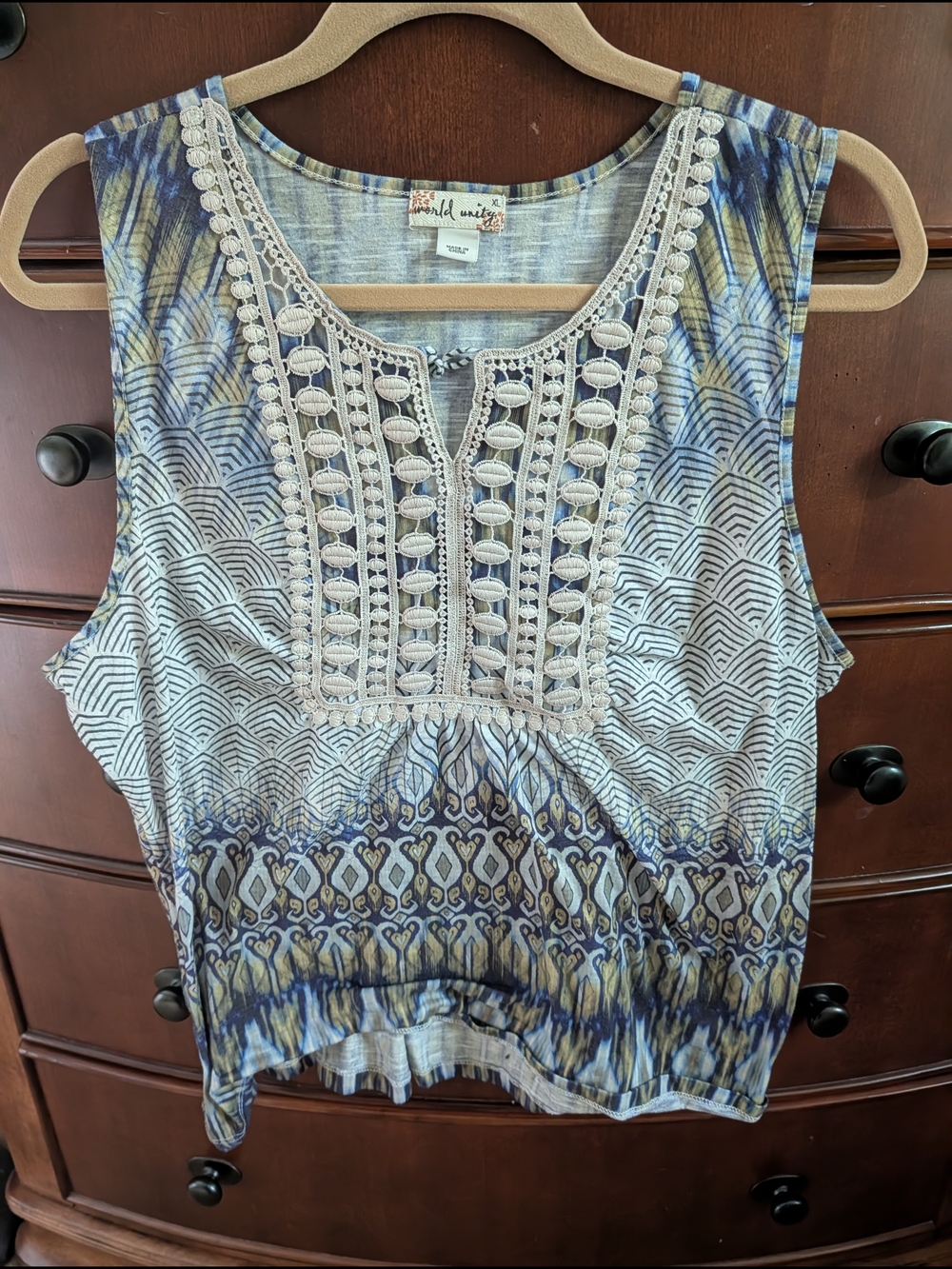 World Unity Sleeveless Top with blue, green and tan embroidered front.